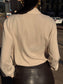 Camicia beige con tasche