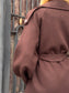 Cappotto con manica a sbuffo e cintura
