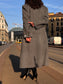 Cappotto lungo sagomato doppiopetto