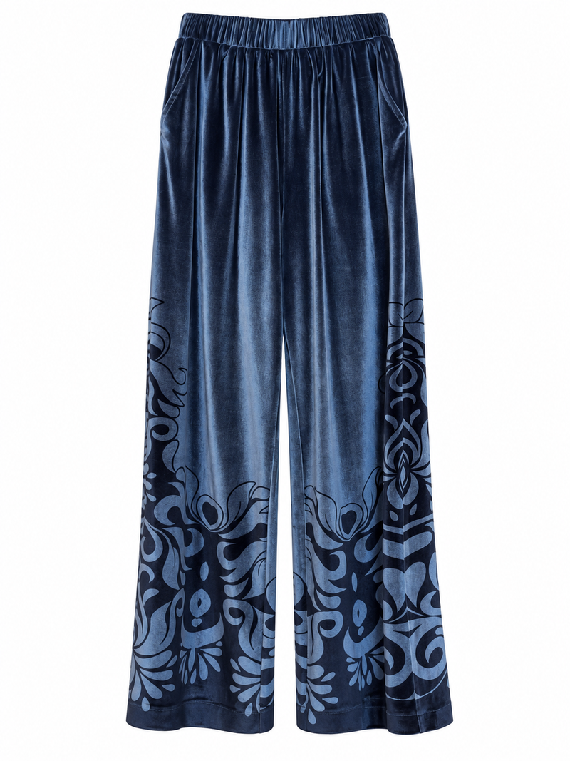 Pantaloni in velluto blu con fantasia ornamentale